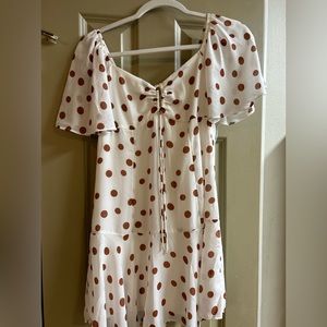 White and brown polka dot dress.